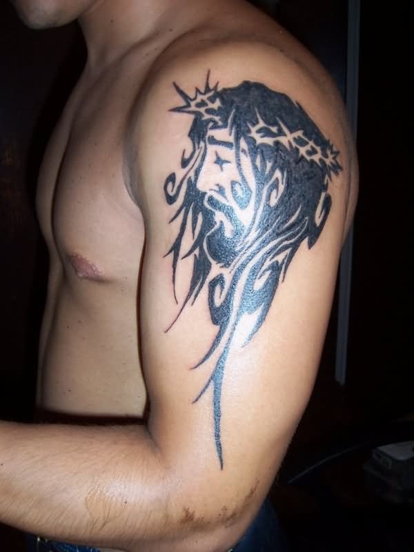 Black Tribal Christian Jesus Face Tattoo On Man Left Shoulder