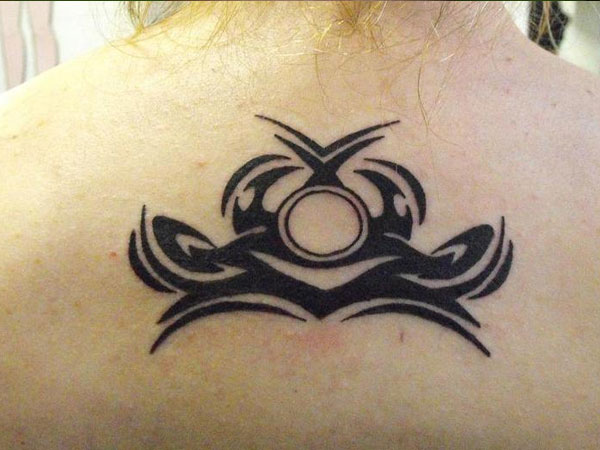 Black Tribal Libra Sun Sign Tattoo On Upper Back