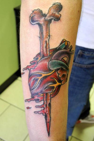 Bone In Real Heart Tattoo On Forearm