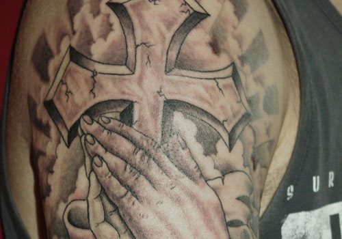 Christian Cross In Praying Hands Tattoo Design For Half Sleeve