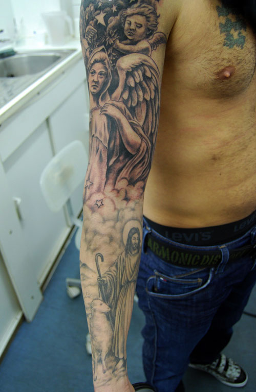 Christian Jesus With Angle And Cherub Tattoo On Man Right Full Sleeve