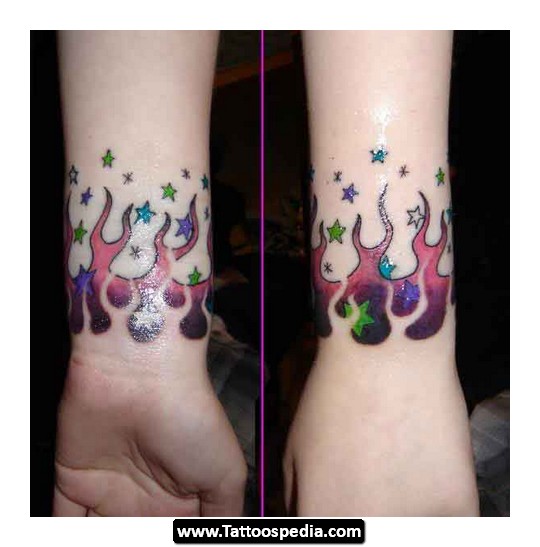 Colorful Flame With Stars Band Tattoo On Wrist