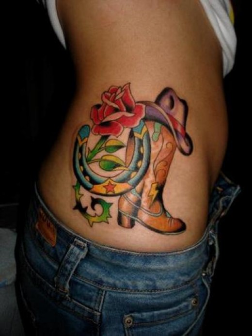 Cool Cowboy Boot With Horseshoe And Rose Tattoo On Side Rib