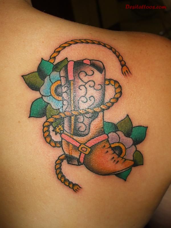 Cowboy Shoe With Flowers And Rope Tattoo On Right Back Shoulder