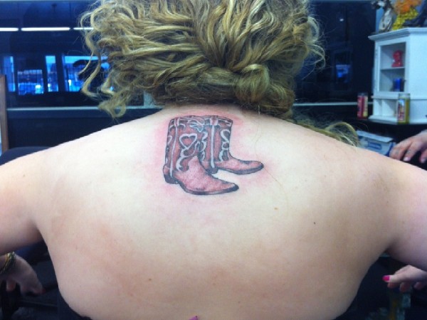 Cowboy Shoes Tattoo On Upper Back