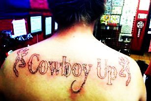 Cowboy Up Lettering Tattoo On Upper Back