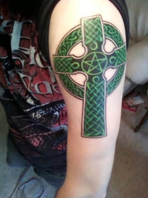 Green And Black Celtic Cross Tattoo On Man Left Half Sleeve