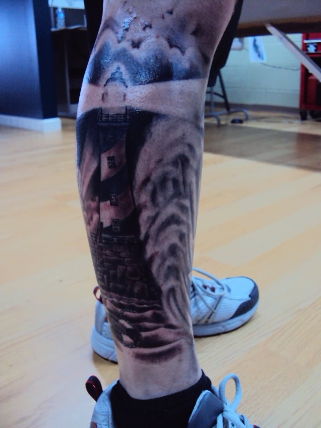 Grey And Black Lighthouse Tattoo On Right Leg