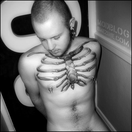 Grey Ink Rib Cage Bone Tattoo On Man Chest