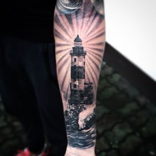 Grey Lighthouse Tattoo On Left Forearm