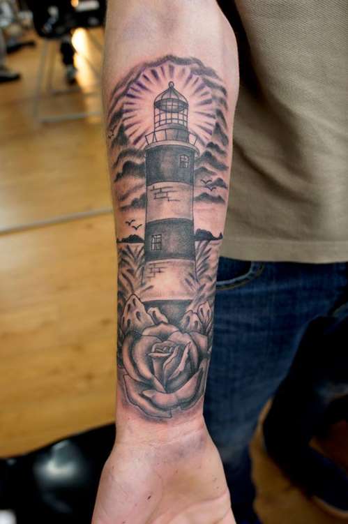 Grey Rose And Lighthouse Tattoo On Forearm