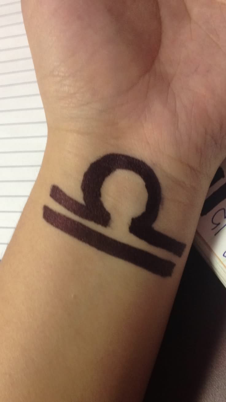 Nice Black Ink Libra Zodiac Tattoos On Wrist