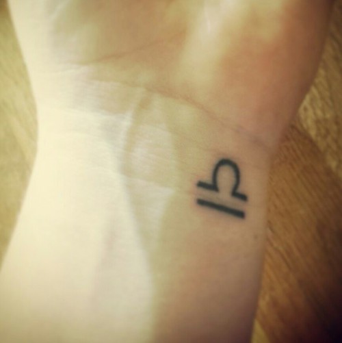 Nice Cute Libra Tattoo On Left Wrist