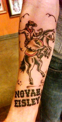 Novah Eisley - Cowboy Riding Horse Tattoo On Forearm