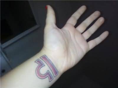 Red Ink Libra Tattoo On Left Wrist For Girls