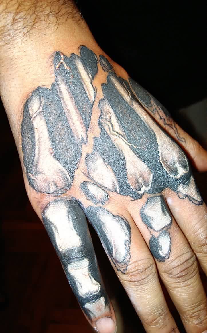 Ripped Skin Hand Bone Tattoo On Hand
