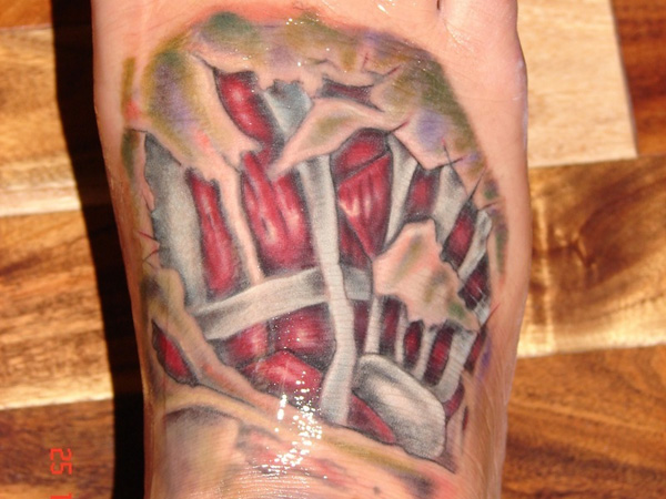 Ripped Skin Muscle And Bone Tattoo On Foot