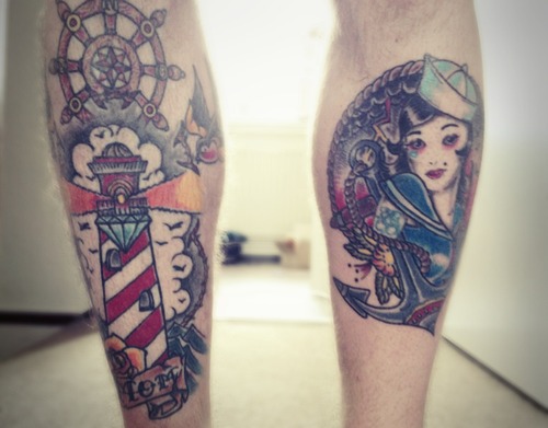 Sailor Girl With Anchor And Lighthouse Tattoo On Back Legs