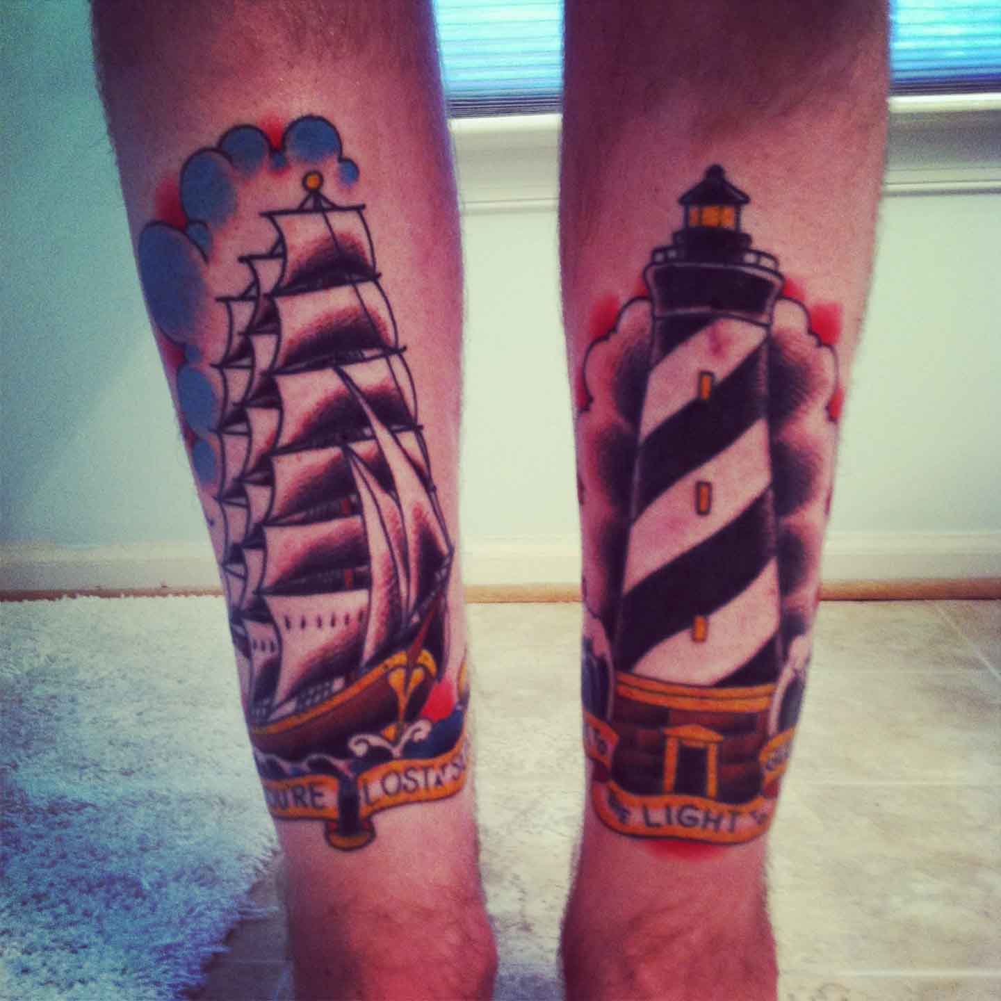 Ship And Lighthouse Tattoos On Leg
