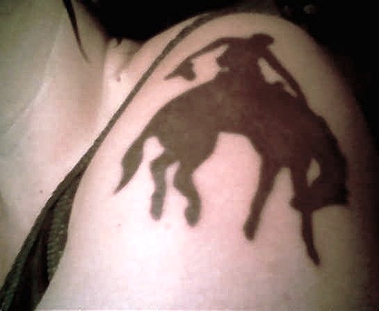 Silhouette Cowboy Riding Horse Tattoo Design For Shoulder