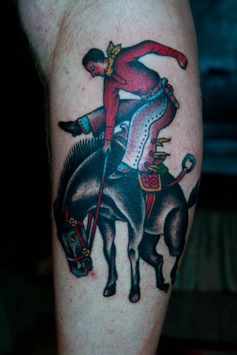 Traditional Cowboy Riding Horse Tattoo Design For Arm