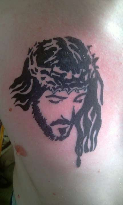 Tribal Christian Jesus Face Tattoo On Man Chest