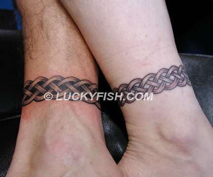 Two Celtic Band Tattoo On Couple Leg