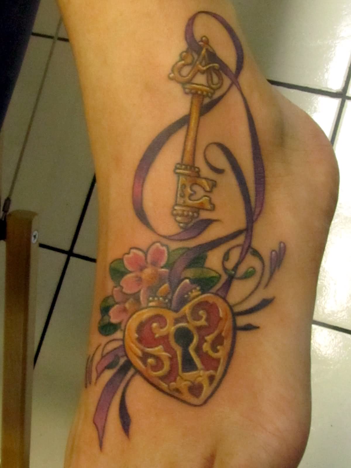 Amazing Heart Lock With Key And Flowers Tattoo On Foot