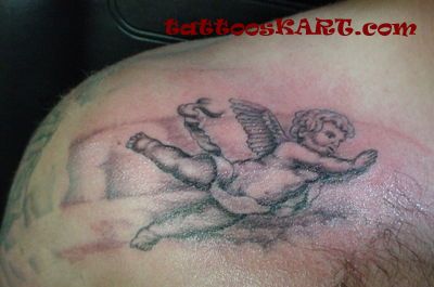 Black And Grey Cupid Cherub Tattoo On Back Shoulder