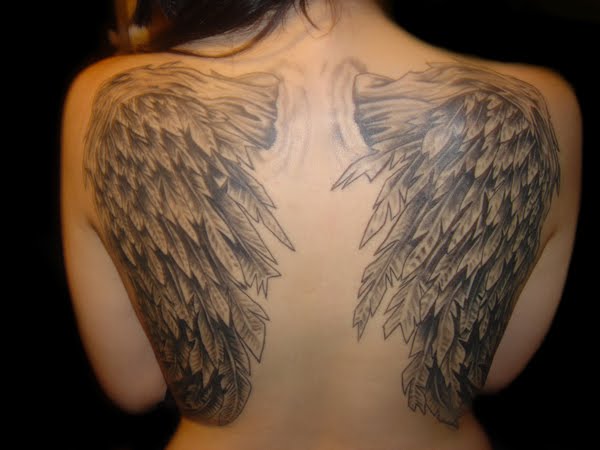 Black And Grey Cupid Cherub Wings Tattoo On Back