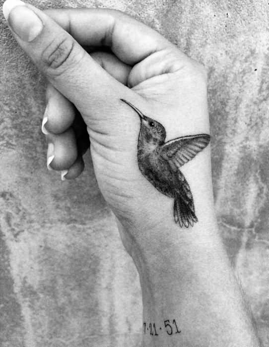 Black And Grey Hummingbird Tattoo On Girl Hand