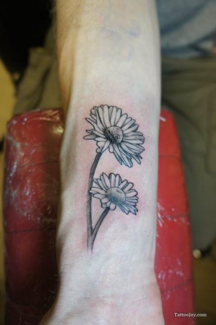 Black And Grey Two Daisy Flowers Tattoo On Wrist
