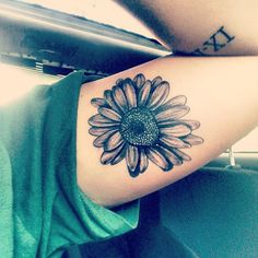 Black And White Daisy Flower Tattoo On Bicep
