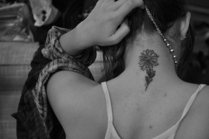 Black And White Daisy Flower Tattoo On Girl Back Neck