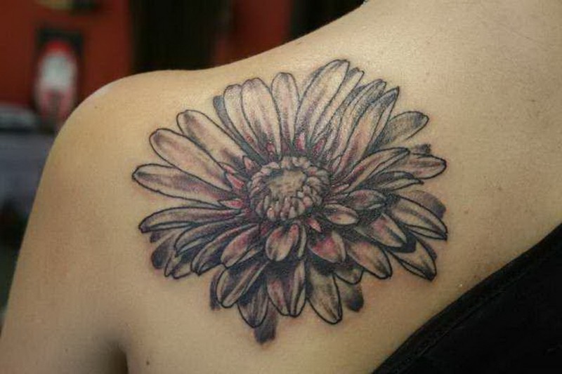 Black And White Daisy Flower Tattoo On Left Back Shoulder