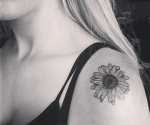 Black And White Daisy Tattoo On Girl Left Shoulder