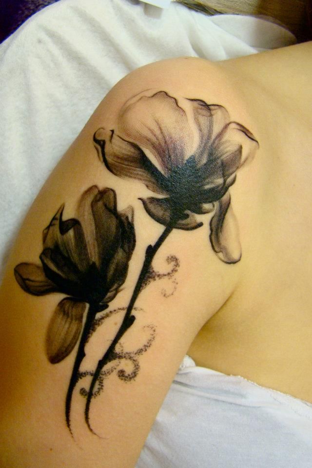 Black And White Two Daisy Flowers Tattoo On Shoulder
