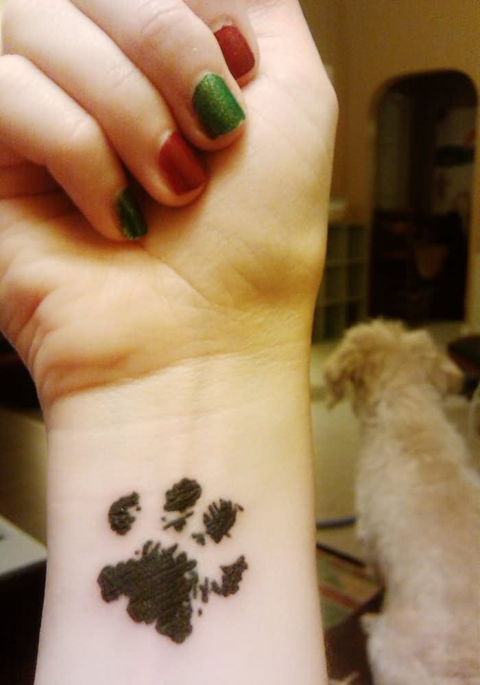 Black Dog Paw Print Tattoo On Girl Hand