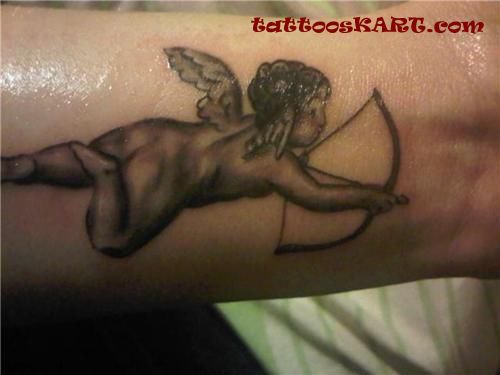 Black Ink Bow And Arrow In Cupid Cherub Hand Tattoo Design For Forearm