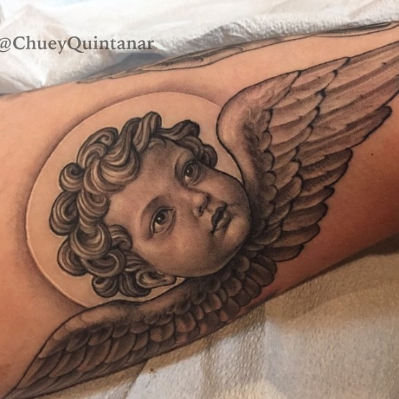Black Ink Cupid Cherub Head With Wings Tattoo Design For Forearm