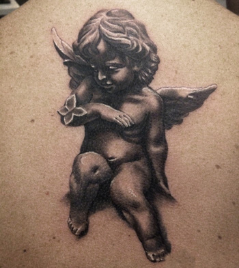 Black Ink Cupid Cherub Tattoo On Upper Back