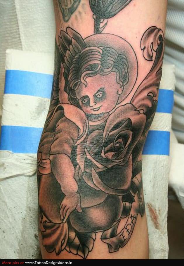 Black Ink Cupid Cherub With Rose And Banner Tattoo Design