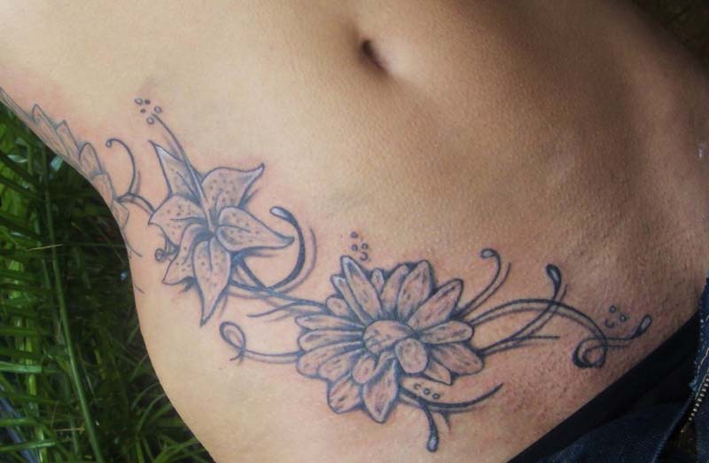 Black Ink Daisy Flowers Tattoo On Side Rib