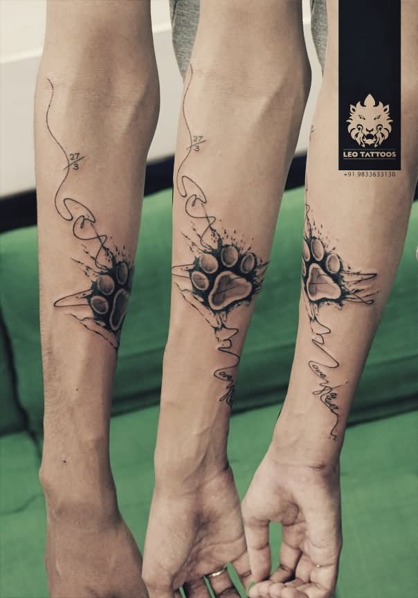 Black Ink Dog Paw Print Tattoo On Forearm