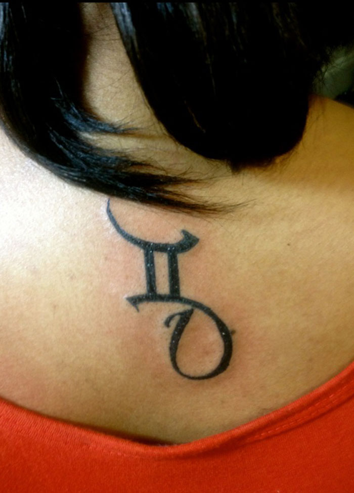 Black Ink Gemini Zodiac Sun Sign Tattoo On Girl Upper Back