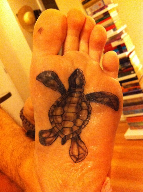 Black Ink Turtle Tattoo On Under Foot