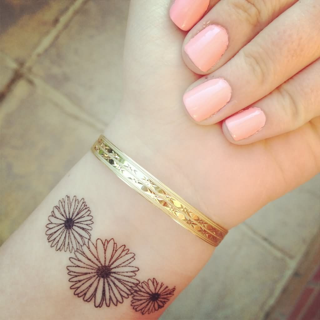 Black Outline Three Daisy Tattoo On Girl Wrist