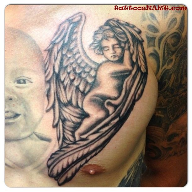 Black ink Sleeping Cupid Cherub Tattoo On Man Chest