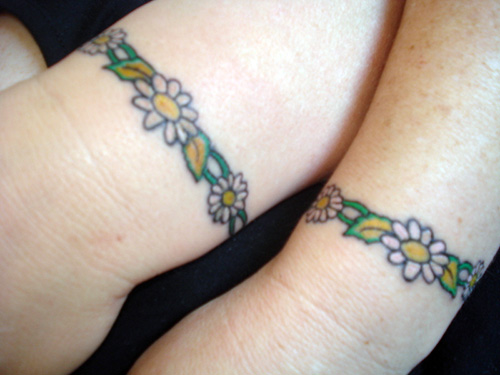 Colorful Daisy Band Tattoo Design For Wrist