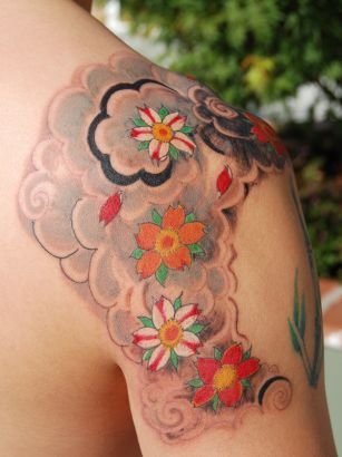 Colorful Daisy Flowers Tattoo On Right Shoulder